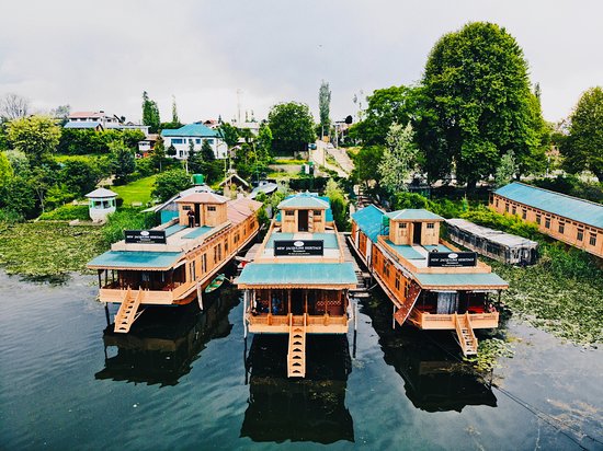 Nigeen Lake Houseboats: Kashmir’s Hidden Sanctuary with Denizen Holidays Imagine waking to the gentle lap of water against cedarwood walls, sipping saffron kahwa on your private deck as the sun gilds the Zabarwan Mountains. This is the magic of Nigeen Lake—Srinagar’s serene counterpart to bustling Dal Lake. At Denizen Holidays, we craft immersive Kashmir trip packages that unlock this jewel-box escape, where tranquillity meets timeless luxury. Why Nigeen Lake Houseboats? • Peace Redefined: Unlike Dal Lake’s floating markets, Nigeen (“Jewel in the Ring”) offers mirror-still waters fringed by willow groves and snow-dusted peaks—ideal for honeymoons or digital detoxes. • Authentic Heritage: Built during the British era, these floating palaces blend walnut wood carvings, Persian rugs, and modern luxuries like Jacuzzis and Wi-Fi. • Wildlife & Views: Spot kingfishers darting over lotus blooms or migratory birds at dawn—all from your balcony. Top Houseboats & Experiences Table: Curated Stays for Every Traveler Houseboat Highlights Price/Night Ideal For New Jacqueline Private Jacuzzi, sunset decks ₹16,000+ Honeymoons, luxury seekers Akbar Heritage Hand-carved panels, lake-view dining ₹5,000+ Cultural travelers Peacock Houseboats Vintage charm, Shikara gazebo ₹5,500+ Families, photographers Wangnoo Sheraton Corporate meeting spaces, gourmet cuisine ₹8,000+ Group retreats Unforgettable Moments: 1. Sunrise Shikara Rides: Glide past floating gardens to Hazratbal Shrine while vendors offer saffron and pashminas. 2. Starlit Dinners: Savor Gushtaba (spiced meatballs) on your deck as lanterns flicker over the water. 3. Wellness Mornings: Practice lakeside yoga or soak in a rose-petal bath (luxury boats only). Tailored Kashmir Packages with Denizen Holidays 1. Romantic Escapes: Our Kashmir honeymoon trip package includes: o 2 nights at New Jacqueline Houseboat with a champagne breakfast o Private Shikara ride with floral decorations o Couple’s spa session using rose-infused oils 2. Signature Kashmir Tour Package: o 3 nights in a heritage houseboat (like Peacock or Akbar) o Mughal Gardens tour + Shankaracharya Temple visit o Optional day trips to Gulmarg for gondola rides 3. Corporate Retreats: o Team-building Shikara races or carpet-weaving workshops o Strategy sessions in Wangnoo Sheraton’s conference room with Dal Lake views o Customizable itineraries for groups of 10+ 610 Why Travellers Choose Us • Seamless Logistics: Airport transfers, permits, and 24/7 support included. • Sustainable Stays: We partner with eco-certified houseboats using solar power and waste management systems. • Local Secrets: Our guides reveal hidden gems like Nigeen Club’s colonial-era charm. Plan Your Escape Best Time to Visit: April–October for gardens in bloom; December–February for snowy serenity. Pro Tip: Book 3+ months early for luxury boats like New Jacqueline! 🌐 Explore Nigeen Lake Packages: www.kashmirtourpackage.co 📱 Instant Booking Support: WhatsApp 9906250867 "On Nigeen Lake, time flows like the Jhelum—gentle, deep, and full of stories waiting to be lived." – Denizen Travel Diaries